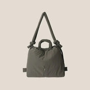 Luxe gewatteerde tas donkergrijs met strikdetail en schouderriem