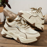 White and beige chunky sneakers with mesh detail angled view