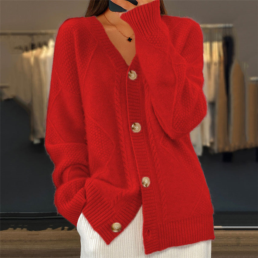 Red knitted cardigan with gold buttons close-up