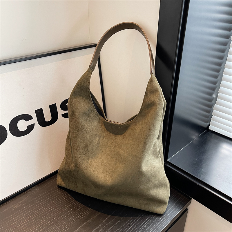 Beige suede hobo bag front view