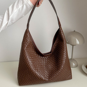 Brown woven leather hobo bag side view