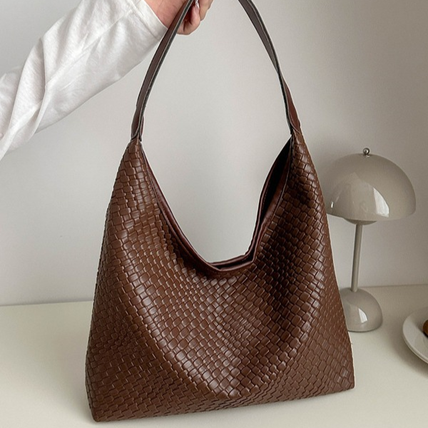 Brown woven leather hobo bag side view