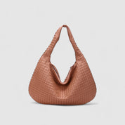Light pink woven hobo bag front view