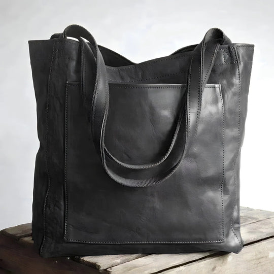 Leather tote bag with large front pocket, black color, front view