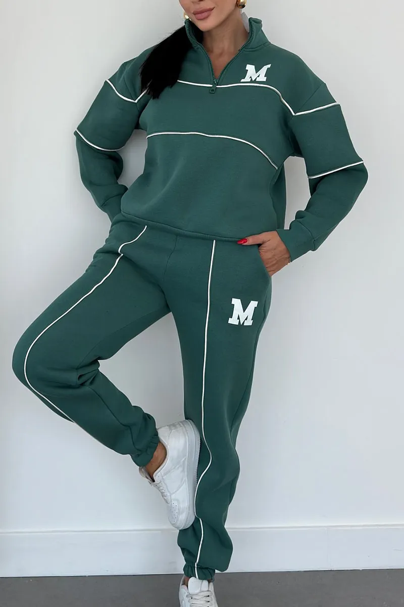 Green half-zip tracksuit with white stripes front view