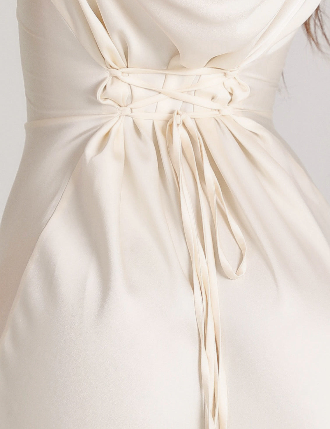 White maxi dress with tie waist detail close-up