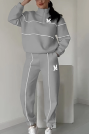 Gray half-zip tracksuit with white stripes front view