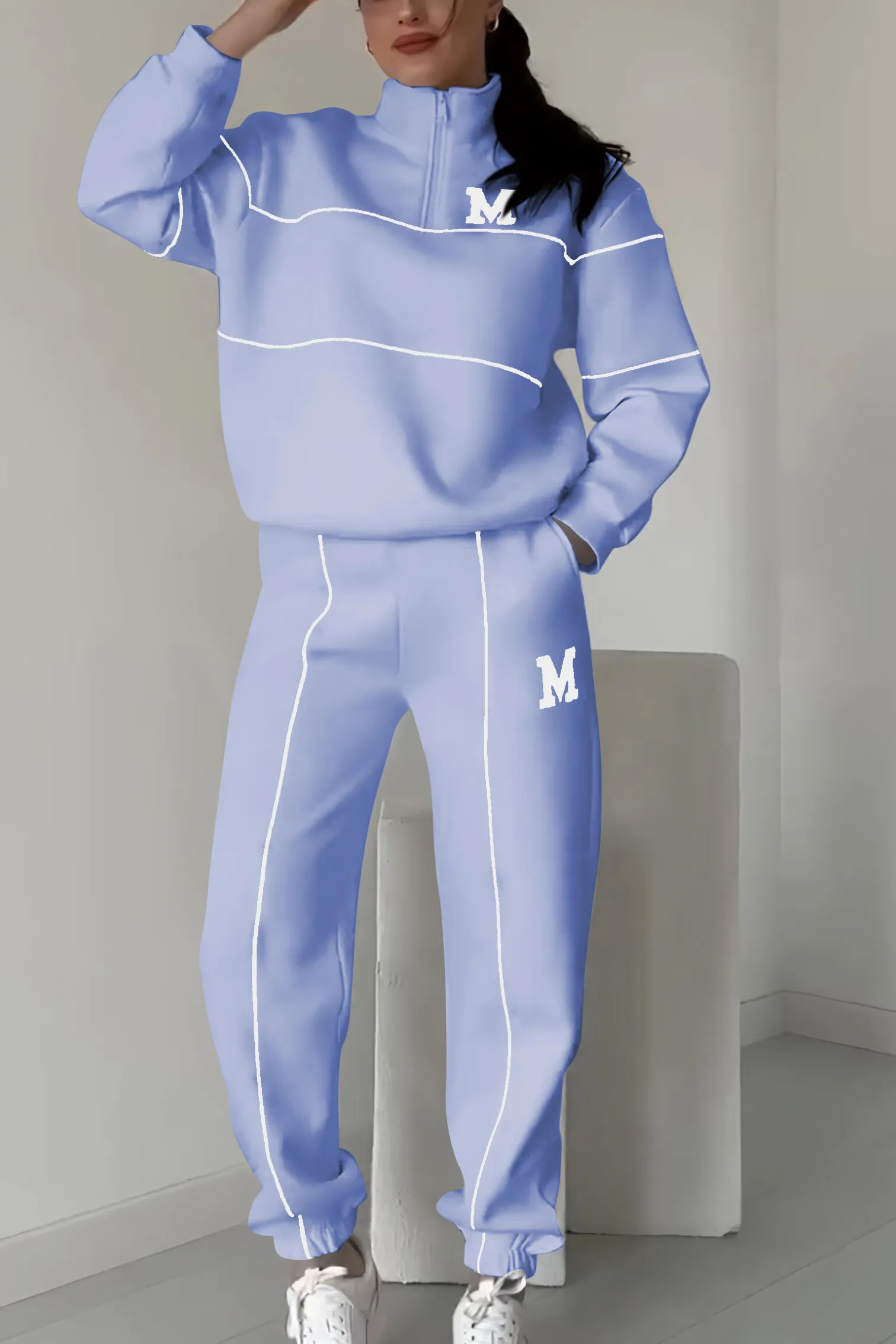 Light blue half-zip tracksuit with white stripes front view