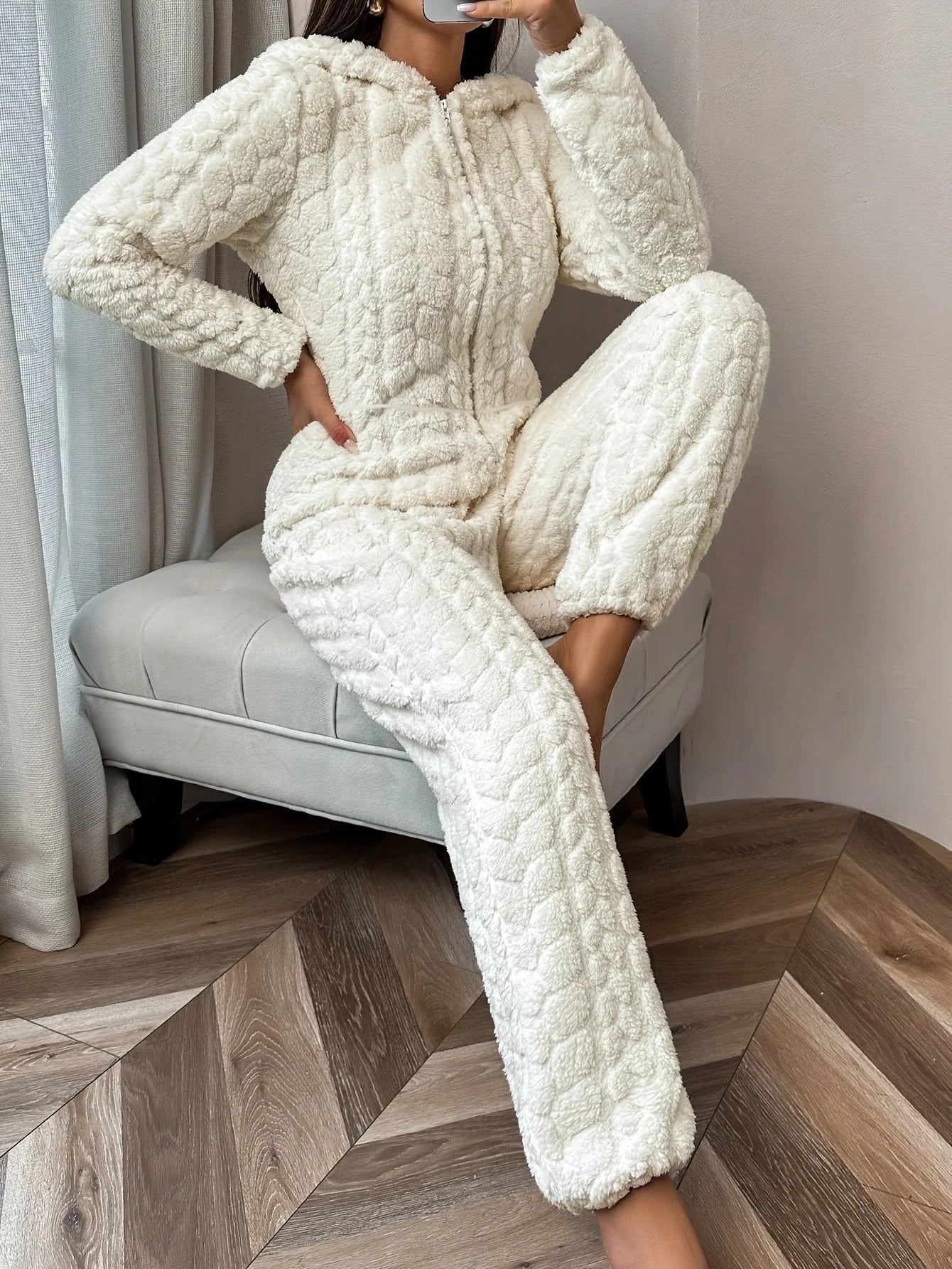 Cream plush onesie with hood and zipper, front view