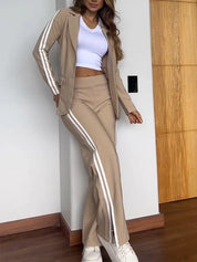 Beige track suit with white stripes side profile