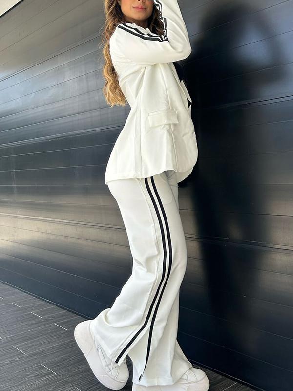 White track suit with black stripes three-quarter view
