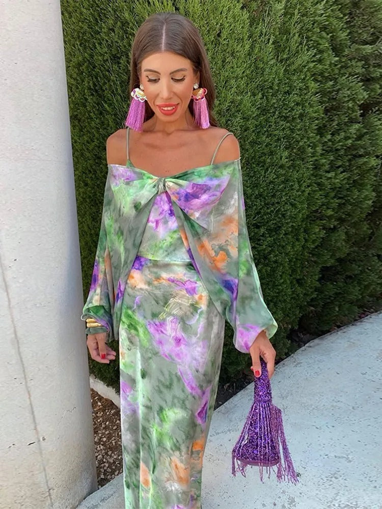 Maxi dress with floral print and off-shoulder bow, side view