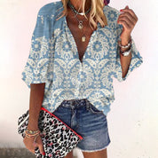 Damask blouse light blue with floral pattern and bell sleeves