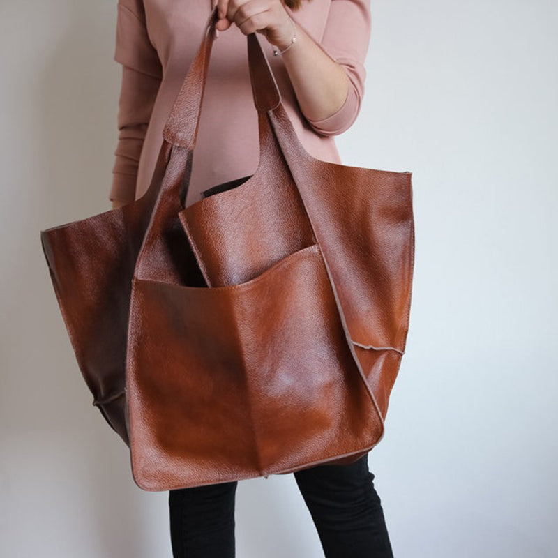 Brown slouchy tote with large exterior pockets, front view