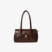 Beige vegan leather shoulder bag on white background