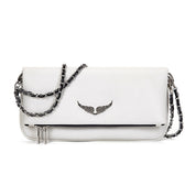 White leather clutch with silver chain and wing embellishment, front view