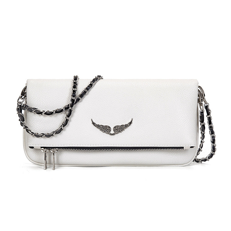 White leather clutch with silver chain and wing embellishment, front view